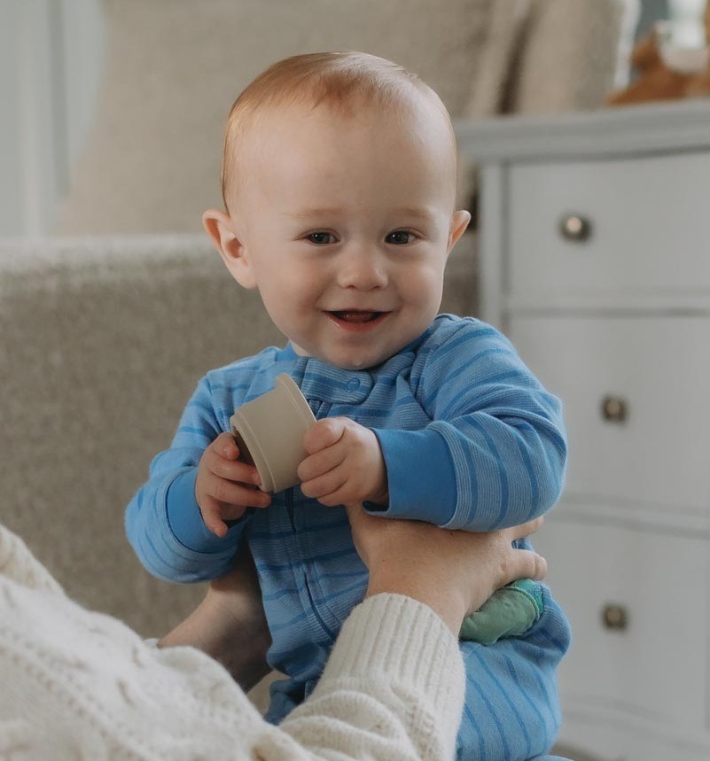 baby smiling at camera